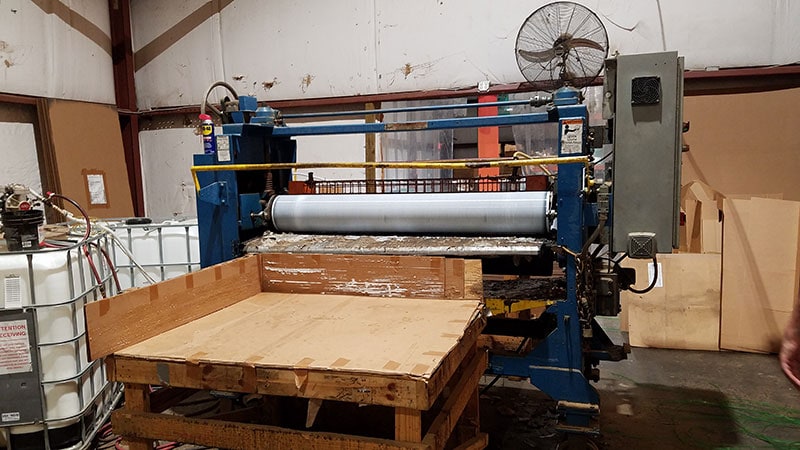 Film rolling machine for pallets