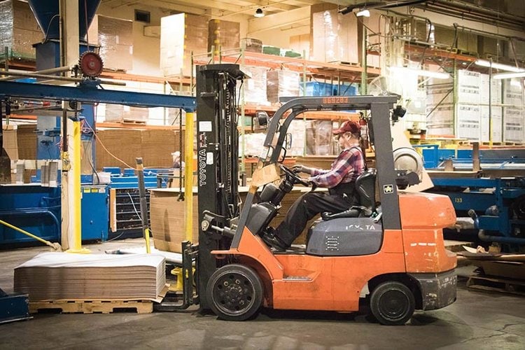 forklift operator in packaging warehouse